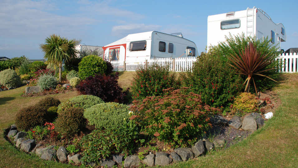 Skegness Sands club site view of a caravan pitch and awning set up