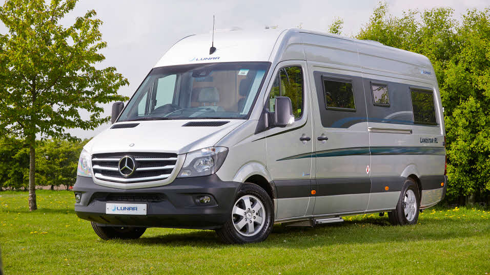 silver motorhome with a high top